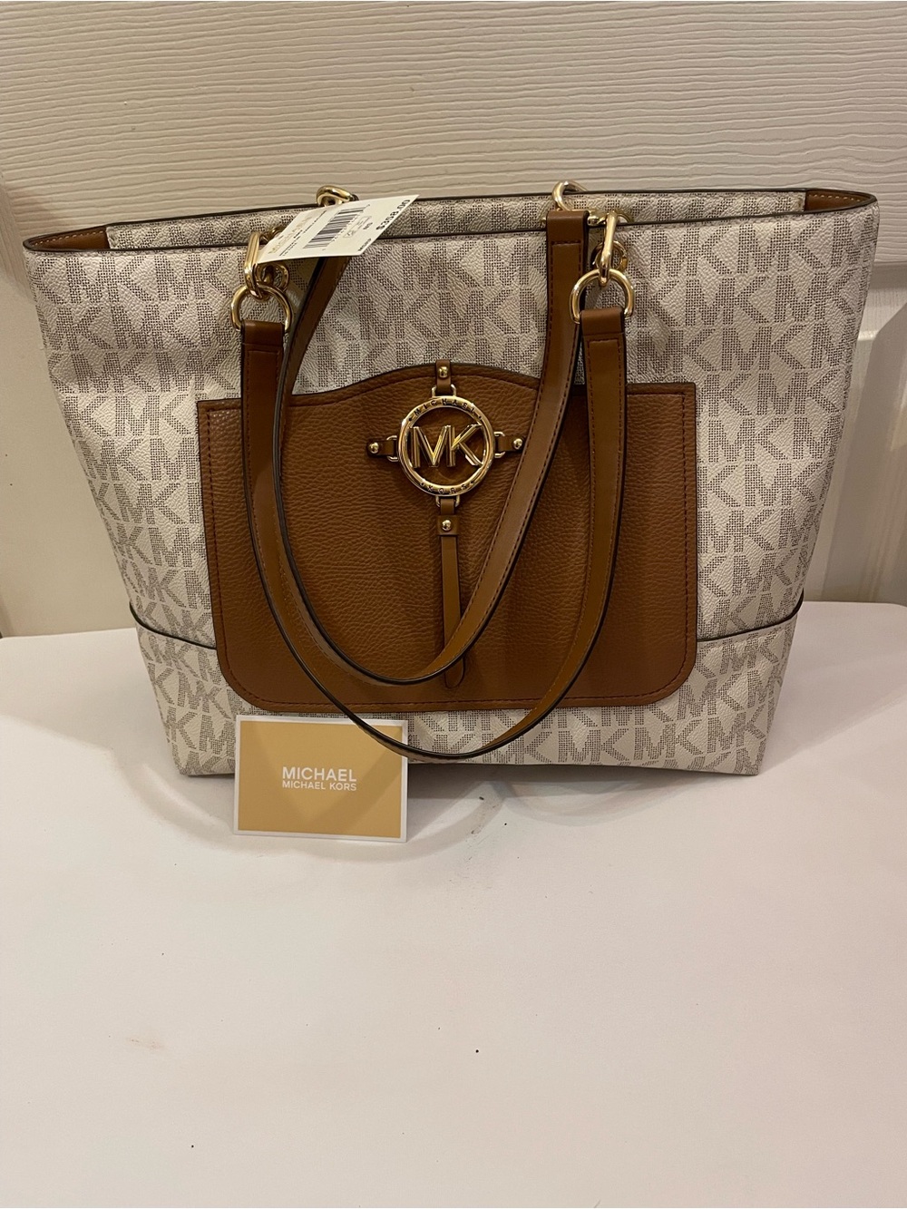 New MICHAEL Kors Vanilla Logo Tote with Brown Leather Trim in the vanilla/corn